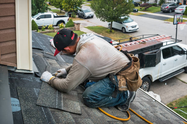 Professional Storm Damage Roof Repair technician working in Buxton, NC
